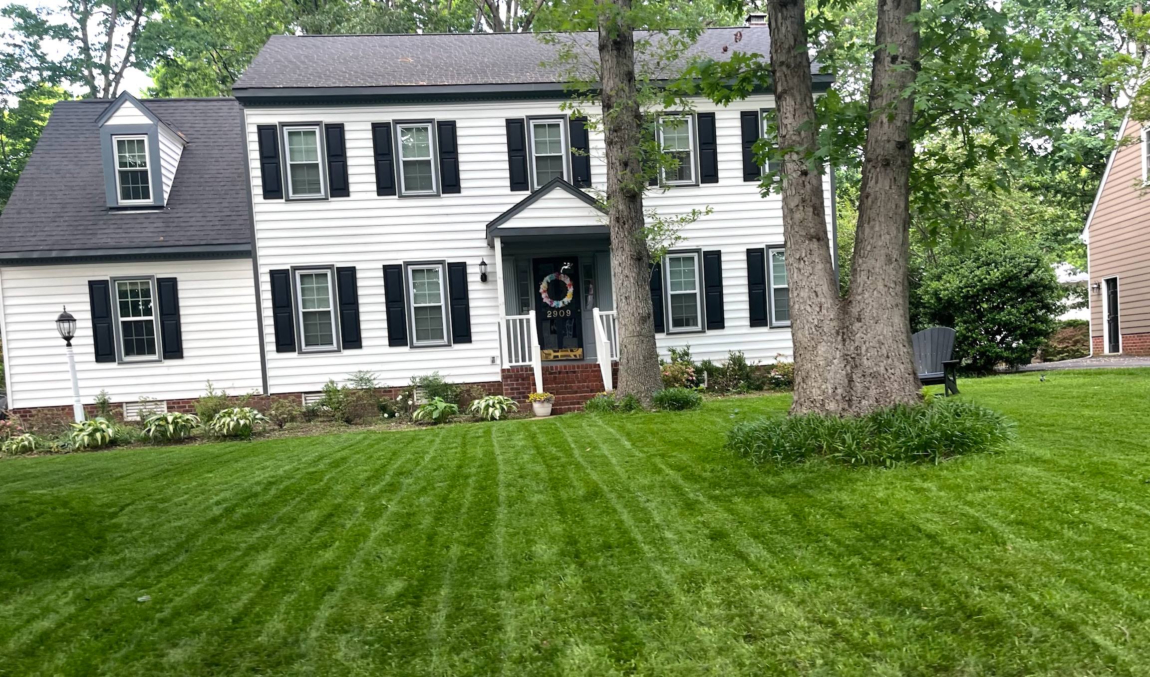 After photo 1: Same house - now thick, lush, and professionally striped